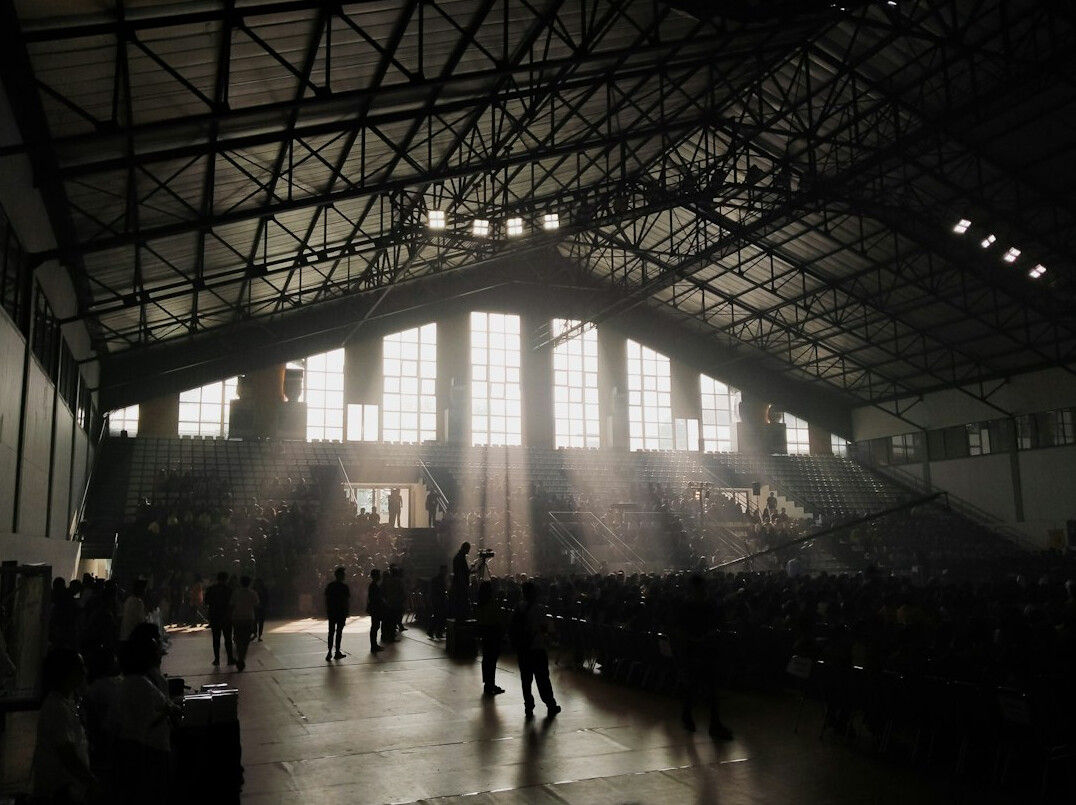 Audience listening to a speaker at a conference hall